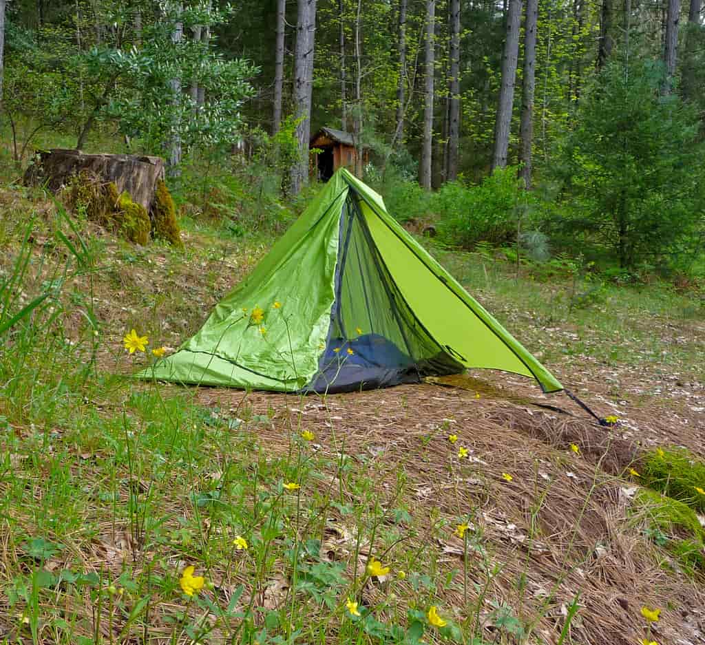 A tent being packed away at the end of a trip