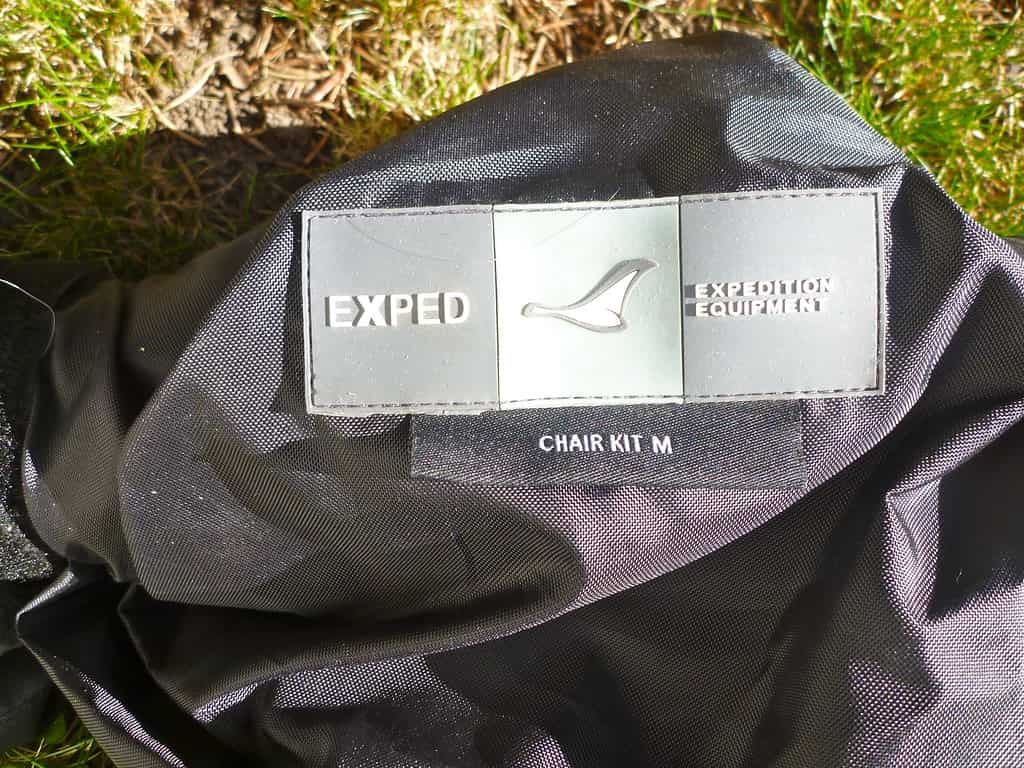 An insulated sleeping mat rolled out for camping